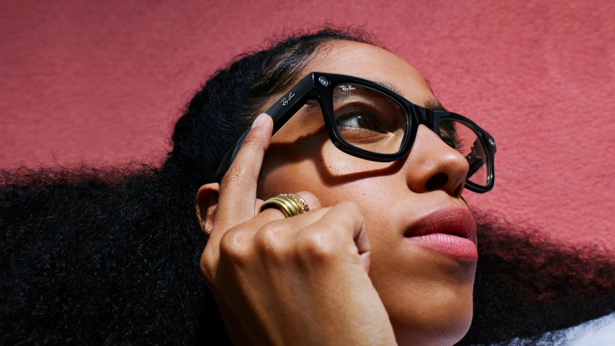 A person wearing black Ray-Ban Meta smart glasses, photographed for the official launch.
